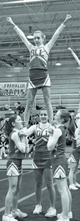 Rah, rah, rah Our Lady of the Lake Varsity Cheer Team competes in the Grammar School Cheer Division. From L to R Front- Katie Janov, Amanda Libero, Cassie Zoetjes and Amber Fleming.