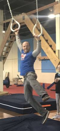 Chris Ennis, the owner of the new Skyland's Ninja Warrior Gym, shows how to conquer the ring obstacle