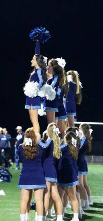 Sparta girls cheer on Friday night. Cheerleading competition is here.