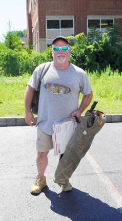 Raymond Smith, Jr. just finished his six hour wait at the Newton Motor Vehicle Agency. (Photo by Vera Olinski)