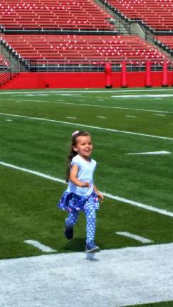Sparta Bears attend Rutgers football practice Ava Koerner blasting over the side-line