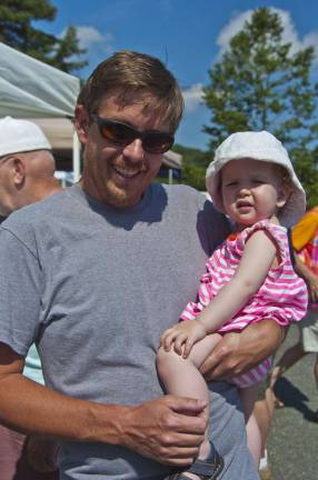 Local sunshine Brad Lovett of Sparta and daughter Leia, 17-months-old, at the Sparta Farmers Market.