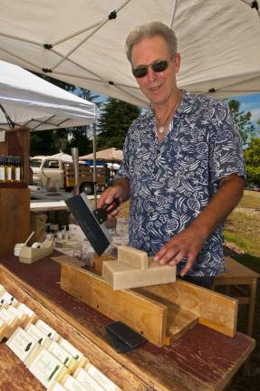 Local sunshine Photos by Warren Westura Mike Theim of Wantage sells his soap at the Sparta Farmers Market.