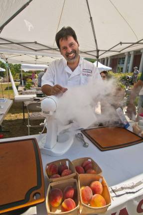 Local sunshine George Mandakas III of Lafayette makes some cryogenic ice cream with liquid notrogen at the Sparta Farmers Market on July 14.
