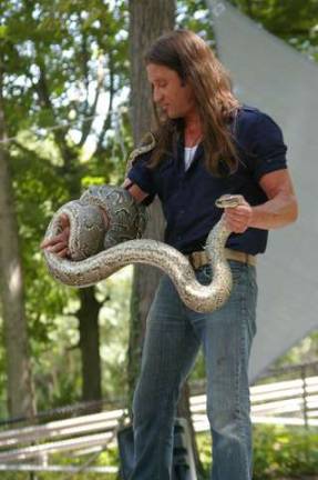 While attempting to pick up and carry this African rock python, the snake repeated tried to bite Urban Tarzan.