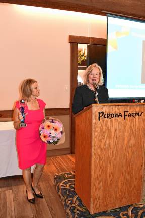 Chamber honors women Tammie Horsfield, left, president of the Sussex County Chamber of Commerce, holds the Woman of the Year award for Deborah Berry-Toon, executive director of Project Self-Sufficiency. (Photos by Maria Kovic)