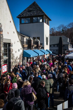 Crowds gather for the German Christmas Market along the Lake Mohawk Country Club (LMCC) Boardwalk.