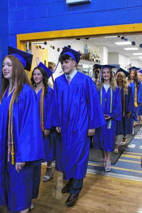 Photos: Pope John XXIII Regional High School graduation Graduates walk through the school on their way to graduation.
