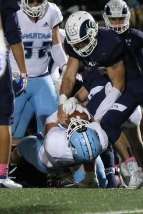 Austin Castorina and Colby Plotss celebrate a touchdown on the Randolph Ram's home field.