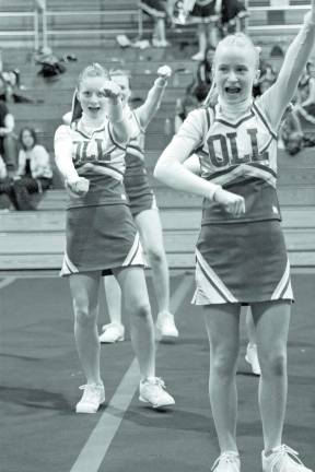 Rah, rah, rah Our Lady of the Lake Varsity Cheer Team competes during the Grammer School Cheer/Dance Competition. Left to Right, Amber Fleming, Courtney Clifford(back), and Co-Captain Caroline Potts.