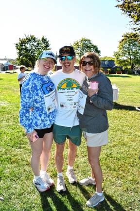 Photos: Celebrate a Life 5K Walk <b>Sarah Strutin of Hackensack and Jake and Colleen Rotunda of Franklin walk in memory of Colleen’s sister Carol, who died of cancer four years ago.</b>
