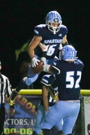 Austin Castorina and Tim Sember celebrate a touchdown.