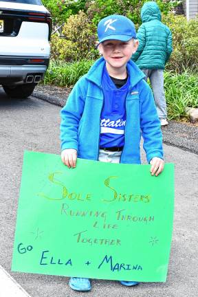 Photos: Girls on the Run Spring 5K Caleb Albinsson of Sandyston cheers on the runners.