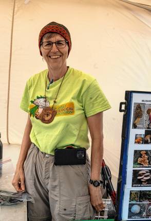 Photos: Earth Day Fair Lyla Meander of the New Jersey Mycological Association wears mushroom jewelry and a hat of yarn dyed with mushrooms.