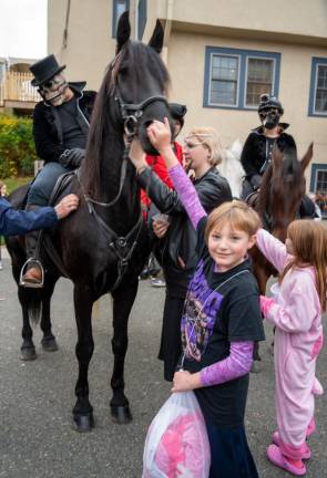 Violet Davis pets the Grim Reaper’s horse, Marley.