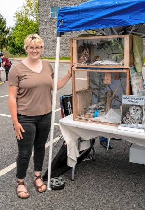 Photos: Earth Day Fair Elizabeth Muller with a blue jay and a screech owl from the Avian Wildlife Center.