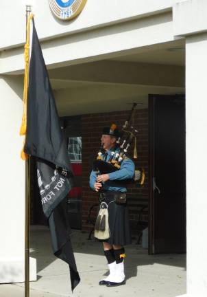 Flags of Newton Newton Police Department Special Officer Steve Moran plays the bagpipes as part of the Flags of Honor ceremony at the Newton Municipal Building on Saturday, Nov. 9, 2019.