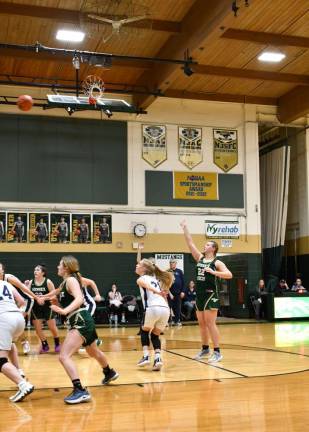 Mackenzie Reilly (22) of Sussex Tech tosses a free throw.