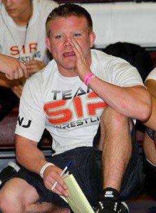 Wrestler turned coach teaches hard work, discipline and pride Livingston coaching his wrestlers at SIR Photos provided