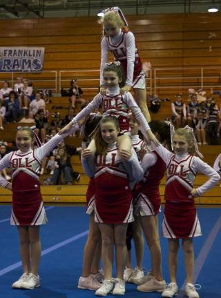Rah, rah, rah Our Lady of the Lake JV Cheer Team closes their Cheer/Dance Exibition with a pyramid. Left to right, front to back, Caty Jhong, Allison Winters, Ashley Potts, Caitie Hanley, Kristen Sansone, Kathleen Whilesmith, Amanda Sansone and Kaetana DeGiovanni.