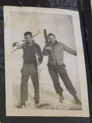 Michael Antoniello (l) and a unit buddy with their skis, taken at their station in the Aleutian Islands during WWII.