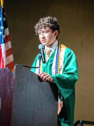Photos: Sussex County Technical School graduation Dylan Castelluccio leads the audience in the Pledge of Allegiance.