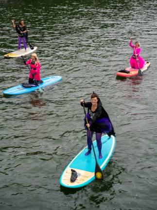 The Witches Paddle raises money for survivors of domestic violence and pediatric cancer. (Photo by Nancy Madacsi)
