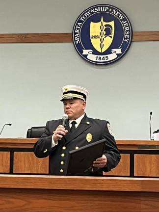 Fire Chief Chris Angelucci holds a proclamation from the Township Council in honor of the department’s 100th anniversary.