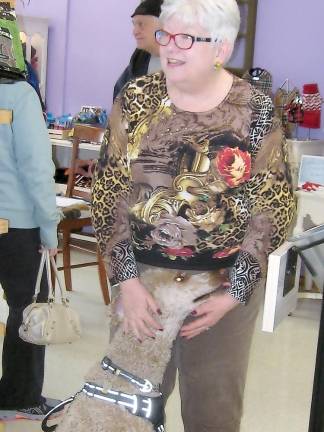 Shop owner Bonnie Bitondo greets one of her canine customers.