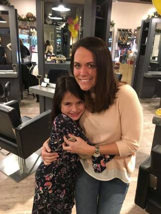 Fredon girl gives gift of her hair for the holidays Sadie Brand with her third grade teacher, Courtney Petermann. Brand followed in Petermann's footsteps and donated her hair for wigs to go to those with cancer.