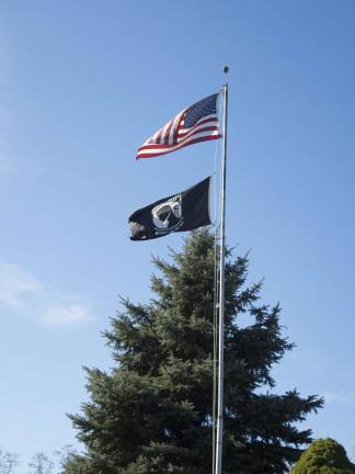 Sparta honors its veterans Old Glory and the POW/MIA banner