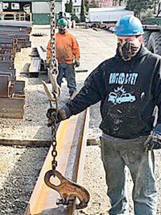 Workers at R.S. Phillips Steel in Vernon wear handmade face masks donated by the Vernon Township Woman’s Club.