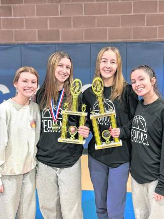 The Veritas girls basketball team wins the Metro Conference league and tournament championships. From left are seniors Liv Kretschmer, MacKenzie Morrison, Kayleigh Jeltema and Zoey Torppey. (Photo provided)