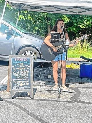 Bands playing at benefits <b>Gabby Toledo plays Saturday morning at the Sparta Farmers Market. (Photo by Stefani M.C. Janelli)</b>