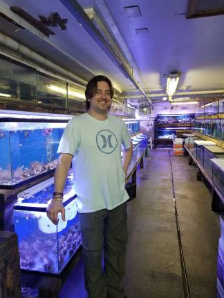 For love of fly fishing Robert Shepard at his place of work: Merit Imports in Paramus. Photo by Rose Sgarlato