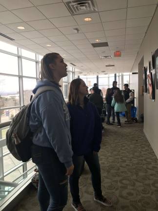 Teen Arts Festival fosters friendships and creativity Maddie Mueller and Amy Hermosillo from High Point high school admired the work of their peers.