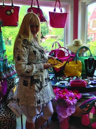 'Anything Goes' at this boutique hidden in Lafayette Village Photos by Laurie Gordon Anything Goes owner Colleen Vanderveen shows off some of her items for sale.