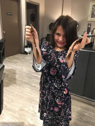 Fredon girl gives gift of her hair for the holidays Sadie holds the locks that will be donated
