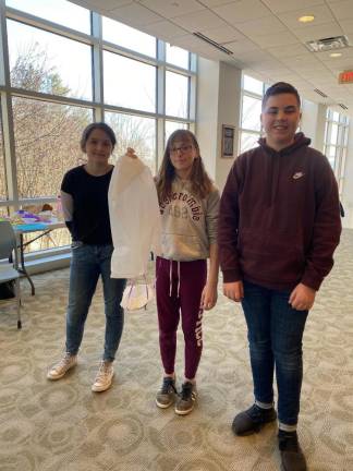 (From left): Smanatha Werner, Cailin Moran (holding a parachute) and Paul Mele.