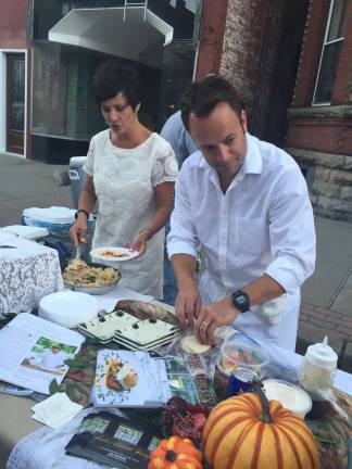 Yoga and lunch, anyone? Tracey and Andre deWaal, owners of Andre's lakeside Dining, are well-known for their community involvement, as shown here at the Taste of Newton benefit. Photo by Laurie Gordon