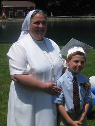 Auxilium School closing after 41 years Charlie Lauzon with Sister Lou Ann. (Charlie is now at Pope John High School) Photos provided