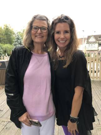 Kim Spangenberg, left, chief executive of DASI: Domestic Abuse &amp; Sexual Assault Intervention Services, and Dodie Guardia, organizer of the Witches Paddle fundraiser, pose before the event. (Photo by Kathy Shwiff)