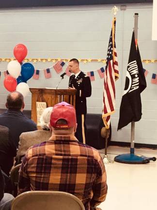 Major Jamie Michel addresses the assembly