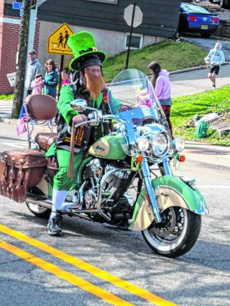 This leprechaun has a sweet ride.