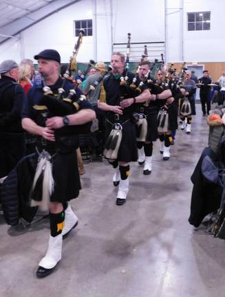 Police Pipes and Drums of Morris County leads the processional to kick off the Dining for Duffy beefsteak dinner at the Sussex County Fairgrounds on Saturday, Feb 15, 2020.