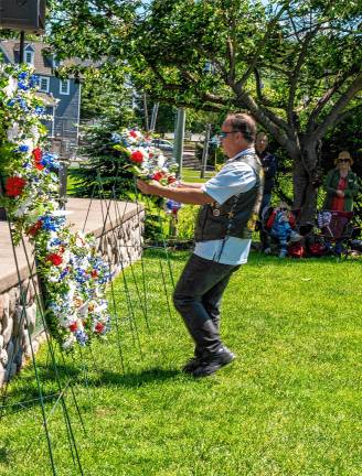 Photos: Memorial Day Parade A member of the Blue Knights places a wreath.