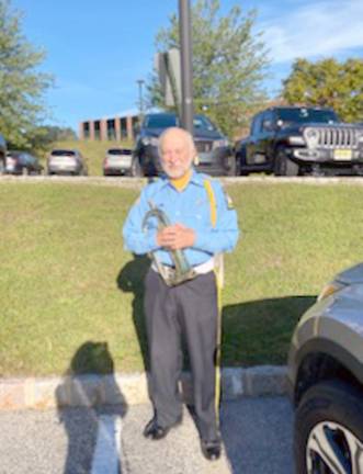 Bob Caggiano, a former member of the Air Force and current member of Bugles Across America, welcomed attendees by playing Wide Blue Yonder and other songs from all of the branches of the armed forces. He performed Taps during the ceremony. (Photo by Laurie Gordon)