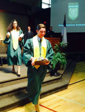 Class of '15 graduates from Veritas Christian Academy Photos by Joe allison Veritas graduates receive their diplomas.