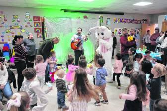 Children dance to the music of Eric Waldman, also known as Bobby Beetcut, at Breakfast with the Easter Bunny on Saturday, March 23 at the Sparta Public Library. (Photos by Dave Smith)
