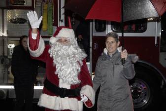 Santa arrives for Sparta’s annual Christmas tree lighting Dec. 1 at Town Hall. At right is Jeanne Montemarano, the township’s recreation director.